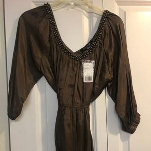 Top! Super cute with jeans, leggings or shorts.